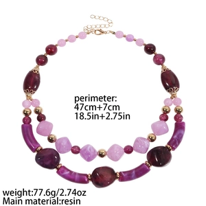 Double-layered chunky resin beaded necklace in purple and pink with gold metal accents