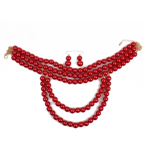 Detail of red multilayer imitation pearl necklace set with matching earrings
