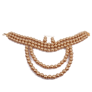 Detailed view of champagne pearl multi-layer necklace and matching hook earrings set