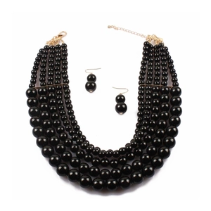 Detail view of five-layer black bead necklace with matching gold-tone drop earrings set