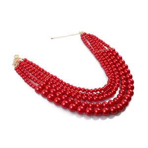 Detail of red multilayer pearl necklace showing five graduated rows and gold lobster clasp