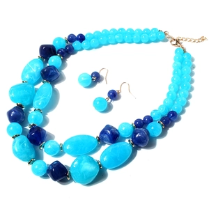 Dubbellaagse blauwe hars kralen ketting set met gemarmerde druppels en gouden details