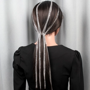 Detail of silver multi-layer tassel hair chain showing waterfall fringe on ponytail