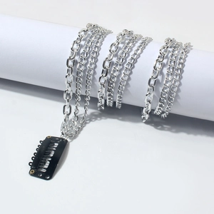 Silver multi-layer tassel hair chain with metal clip on white cylindrical stand