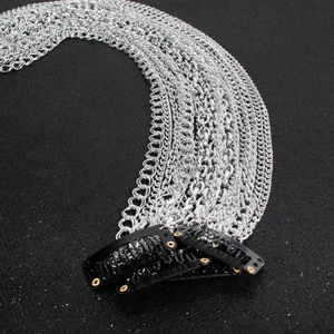 Close-up of silver-plated multi-layer tassel hair chains with black BB clips attached