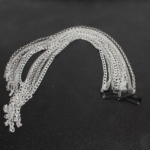 Detail of silver multi-layer tassel hair chain with three black BB clips for easy styling