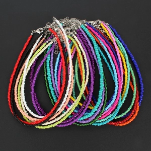 Macro shot of bohemian colorful seed bead choker necklaces with metal lobster clasps