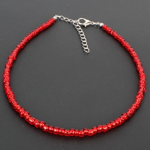 Bohemian style choker featuring vibrant red translucent beads with silver lobster clasp