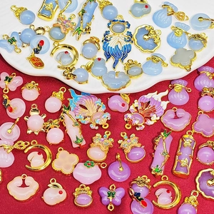 Traditional Chinese style faux jade and gold pendants featuring lotus, rabbit and koi fish