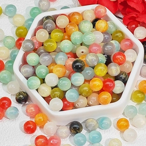 Polished resin beads in vibrant colors and cat-eye textures for DIY jewelry making