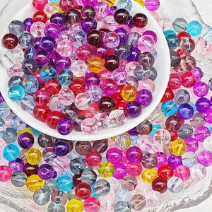 Macro shot of colorful 8mm transparent glass beads for DIY bracelet and necklace making