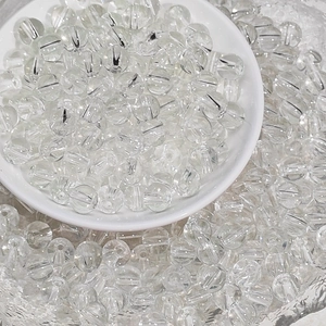 Macro view of 8mm faceted clear round glass beads for DIY bracelet and necklace making