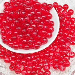Macro shot of 8mm translucent red glass beads for DIY jewelry making and bracelets
