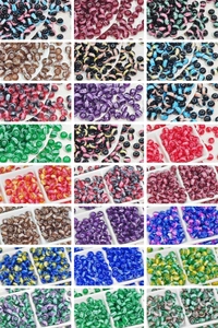 Detailed grid view of assorted colorful glass beads with unique crackle and swirl patterns