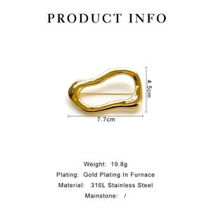 Detailed view of the 7.7cm by 4.5cm irregular gold 316L stainless steel brooch