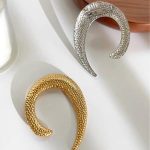 U-shaped stainless steel brooches with hammered texture in gold and silver finish