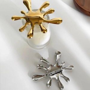 Modern gold and silver stainless steel firework brooches in high polished mirror finish