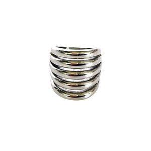 Detail view of silver multi-layer stacked rings with a high-polished mirror finish