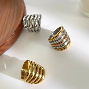 Three-tone stackable spiral stainless steel rings in gold silver and rose gold finish