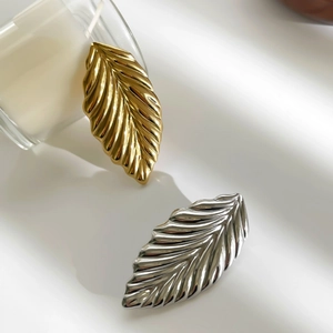Elegant gold and silver leaf brooches with textured metal finish for women's fashion