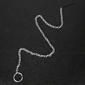 Silver fringe chain hair clip with a minimalist metal ring on a textured black background