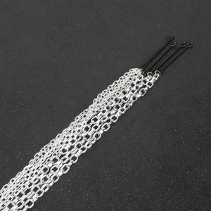 Set of four black hair clips with long hanging silver metal tassel chain extensions