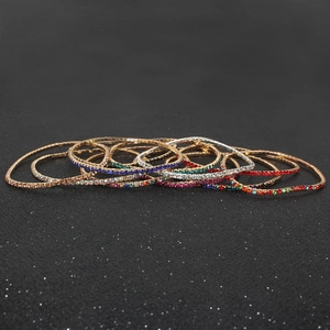 Sparkly multi-colored rhinestone stretch bracelets in gold and silver finish stack