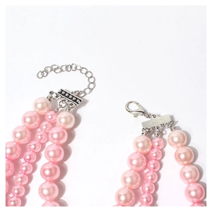 Close-up of pink layered pearl pet collar with lobster clasp and adjustable metal chain