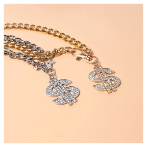 Close-up of dollar sign pet pendant with shimmering rhinestones and thick cuban chain