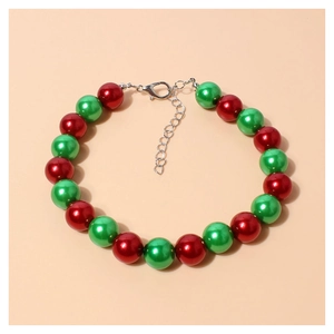 Detailed view of red and green beaded pet necklace with silver lobster clasp and extension chain