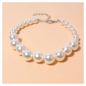 Close-up of elegant gradient pearl necklace for small dogs with silver lobster clasp