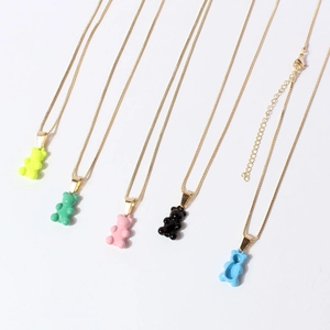 Detail of colorful resin bear pendants on gold thin chains with lobster clasp and extender