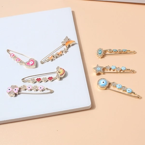 Collection of creative waist pins featuring heart, butterfly, and rainbow crystal charms