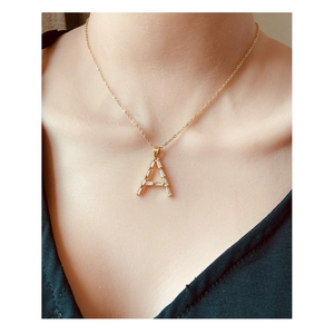 Gold plated letter A necklace with rectangular zircon stones on a gold chain