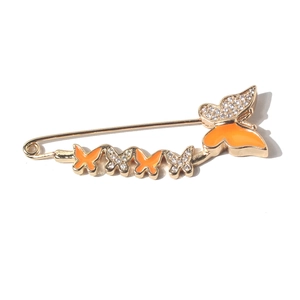 Golden butterfly brooch pin with orange enamel and sparkling crystals for waist adjustment