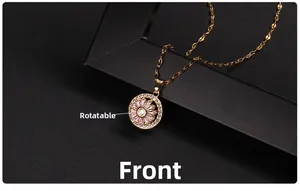 Detailed view of spinning clover necklace with pink zircon petals and gold finish