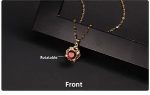 Detailed view of rotatable golden necklace with a faceted red gemstone and zircon accents