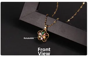 Close-up of rotatable clover flower pendant with colorful gems and gold chain