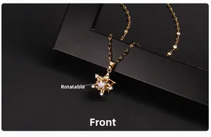 Macro shot of rotatable gold star pendant with sparkling zircon on black frame
