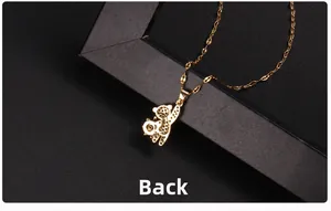 Detailed back view of a golden bear pendant featuring dark zircon micro-pave setting