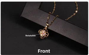 Macro shot of rotating clover necklace with colorful zircons and golden titanium steel chain