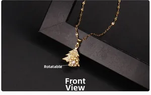 Close-up of golden Christmas tree pendant with 360-degree rotating snowflake and zircons