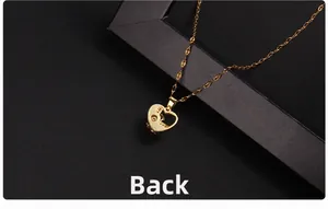 Macro view showing the back detail and polished golden finish of the heart necklace
