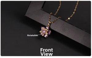Detailed macro view showing the rotating purple gemstone flower pendant with gold plating