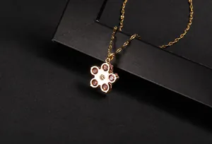 Detailed close-up showing the reverse side of the flower clover pendant with gem settings