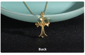 Macro detail of the golden cross pendant back view with micro-inlaid zircon and fine chain