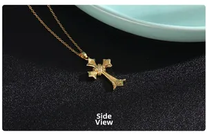 Side profile of gold cross pendant with intricate micro-pave cubic zirconia inlay