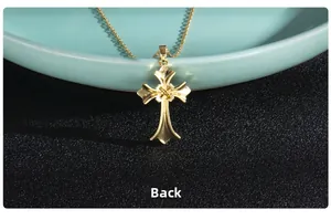 Detailed back view of golden cross pendant showing smooth metal finish and O-chain