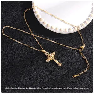 Macro detail of gold plated titanium crucifix necklace with micro zircon stones