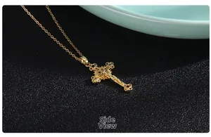 Side view of gold plated cross pendant with multicolored micro inlaid zircon stones